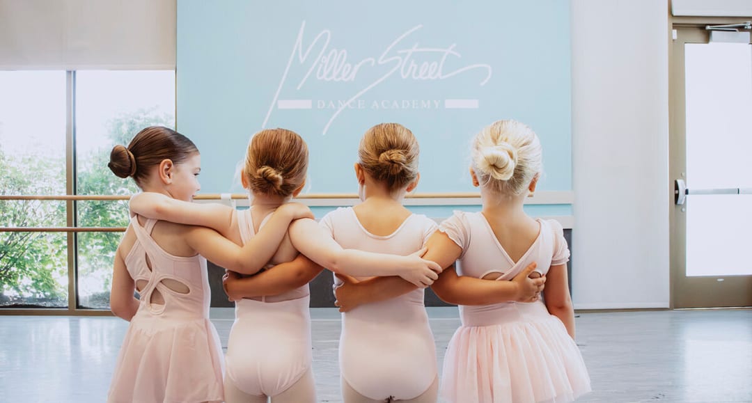 Young dancers lined up together during Snowflake Spectacular at Miller Street Dance Academy